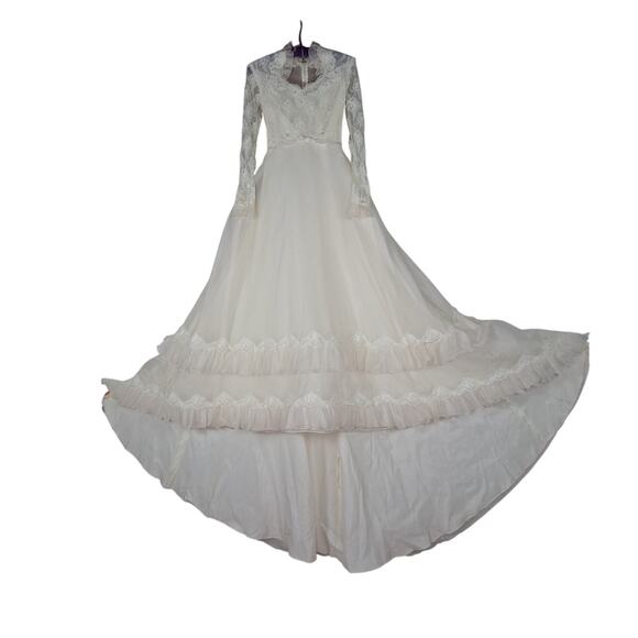 Vintage lace wedding gown high collar neckline long sleeves tiered ruffled skirt Vintage lace wedding gown high collar neckline long sleeves tiered ruffled skirt